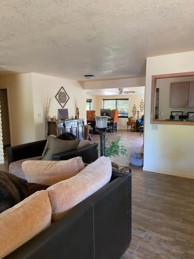 Sedona living room before: dark furniture and closed-off layout