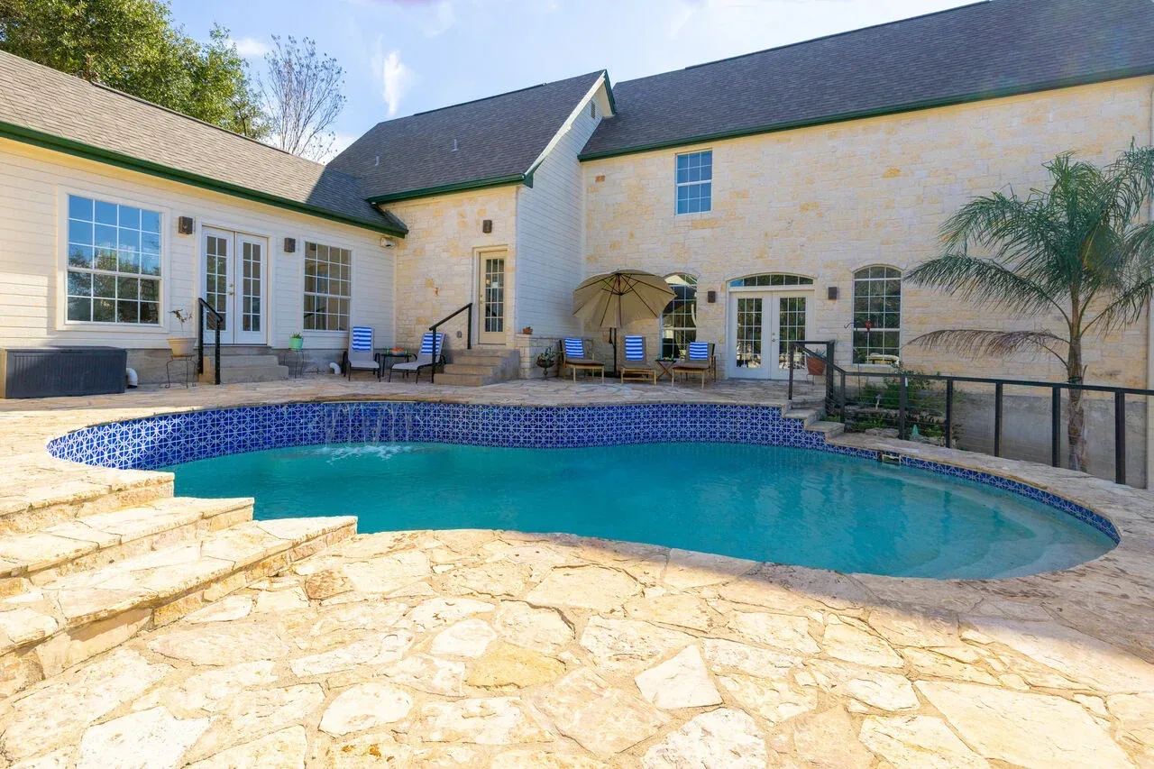 Texas Hill Country home and private pool in bright daylight